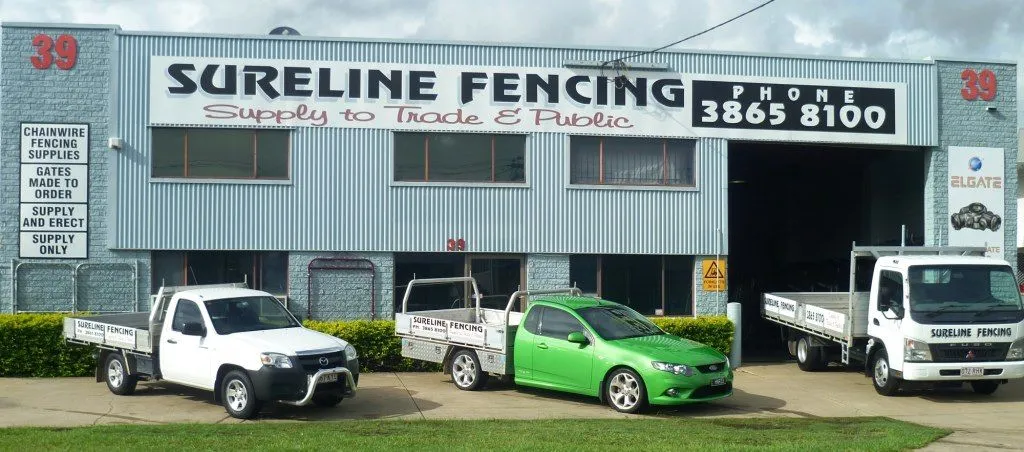 Sureline Fencing shopfront and work utes at 39 Basalt Street, Geebung, with chainwire fencing supplies signage